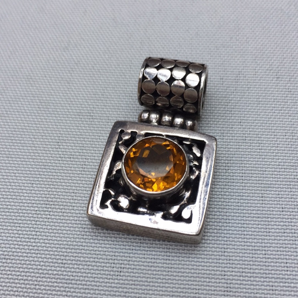 Silver and topaz pendant